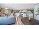 Open-concept living space that connects living, dining, and kitchen areas at 5404 W Rowland Pl, Littleton, CO 80128