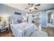 Inviting bedroom with a plush bed, mirrored closet, and calming, neutral decor at 5404 W Rowland Pl, Littleton, CO 80128