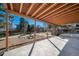 Covered patio featuring a concrete floor, wood columns and ceiling at 5404 W Rowland Pl, Littleton, CO 80128