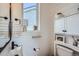 Charming bathroom featuring shiplap walls, floating shelves, and modern fixtures for a cozy and stylish space at 1301 Osceola St, Denver, CO 80204
