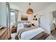 Bright bedroom featuring stylish decor, and a comfortable bed with neutral bedding at 1301 Osceola St, Denver, CO 80204