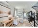Comfortable living room featuring a plush sofa, modern decor, hardwood floors, and a staircase leading to the upper level at 1301 Osceola St, Denver, CO 80204