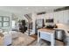 Open-concept living area combining a modern kitchen with a comfortable living space, perfect for entertaining and everyday living at 1301 Osceola St, Denver, CO 80204