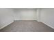 Large finished basement area with neutral carpeting and ample electrical outlets at 9472 E 109Th Pl, Commerce City, CO 80640