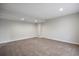 Spacious finished basement with neutral walls and carpet, offering versatile living space at 9472 E 109Th Pl, Commerce City, CO 80640