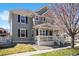 Well-maintained home features a cozy front porch, creating an inviting curb appeal at 9472 E 109Th Pl, Commerce City, CO 80640