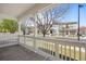 Relaxing covered front porch provides serene views of the neighborhood street at 9472 E 109Th Pl, Commerce City, CO 80640