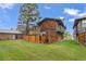 Exterior view of home with wood siding and fenced in backyard at 1347 S Crystal Way, Aurora, CO 80012