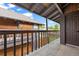 Second-story balcony with natural wood and views of the surrounding buildings at 1347 S Crystal Way, Aurora, CO 80012