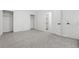 Bright bedroom with neutral carpet features closet and ensuite access at 1347 S Crystal Way, Aurora, CO 80012