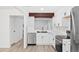 Well-designed kitchen with white cabinets, stainless steel appliances, and ample counter space for meal preparation at 1347 S Crystal Way, Aurora, CO 80012