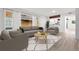 Bright living room with modern furniture, large windows, and stylish décor, creating a welcoming atmosphere at 1347 S Crystal Way, Aurora, CO 80012