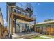 Enjoy outdoor living with a deck, spiral staircase, patio, and fenced yard, perfect for entertaining and relaxation at 3640 Lipan St, Denver, CO 80211