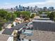 An aerial view highlighting the rooftop decks and cityscape in the background at 3640 Lipan St, Denver, CO 80211