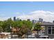 A rooftop deck with an incredible view of the city skyline in the background at 3640 Lipan St, Denver, CO 80211