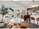 Dining area with a marble table, modern chairs, and a view of the kitchen at 3640 Lipan St, Denver, CO 80211