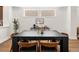 Elegant dining area with a modern table, stylish chairs, and ample natural light, perfect for Gathering meals and entertaining at 3640 Lipan St, Denver, CO 80211