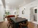 Open dining area with a modern table and chairs, seamlessly connected to the living space, ideal for entertaining guests at 3640 Lipan St, Denver, CO 80211