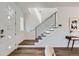 Modern entryway with hardwood floors, contemporary staircase, and stylish door at 3640 Lipan St, Denver, CO 80211