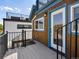 A wood and blue exterior shot, highlighting a door to the outside deck area at 3640 Lipan St, Denver, CO 80211