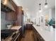 Spacious kitchen featuring stainless steel appliances and a long island with counter seating at 3640 Lipan St, Denver, CO 80211