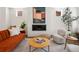 Stylish living room featuring a cozy fireplace, modern decor, and comfortable seating, ideal for relaxation and entertaining at 3640 Lipan St, Denver, CO 80211