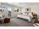 Bright bedroom with hardwood floors, balcony access, and contemporary furnishings at 3640 Lipan St, Denver, CO 80211