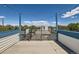 Rooftop deck with string lights, railing and blue trim provides views of the surrounding neighborhood at 3640 Lipan St, Denver, CO 80211