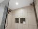 Modern shower featuring dual shower heads, and built-in shampoo/soap niches at 3640 Lipan St, Denver, CO 80211