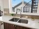 Kitchen features a stainless steel dual sink with a modern faucet and white countertops at 3640 Lipan St, Denver, CO 80211