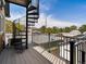 An exterior view featuring a spiral staircase leading to a rooftop deck and railing at 3640 Lipan St, Denver, CO 80211