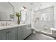 Elegant bathroom with double vanity, marble shower, and modern fixtures at 1601 Mariah Ln, Erie, CO 80516