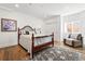 Cozy bedroom with hardwood floors, a decorative rug, and natural light at 1601 Mariah Ln, Erie, CO 80516