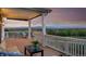 Spacious outdoor deck with mountain views, a fire pit, comfortable lounge seating, and stylish decor at 1601 Mariah Ln, Erie, CO 80516