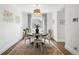 Cozy dining room with round table, area rug, and decorative light fixture at 1601 Mariah Ln, Erie, CO 80516