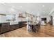 Open floor plan featuring an eat-in kitchen with an island that adjoins the dining and living spaces at 1601 Mariah Ln, Erie, CO 80516