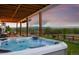 Relaxing hot tub on a wooden deck with scenic views of the surrounding landscape at 1601 Mariah Ln, Erie, CO 80516