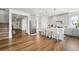 Bright kitchen with a white island, stainless appliances, and light grey cabinetry at 1601 Mariah Ln, Erie, CO 80516