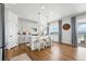 Bright kitchen with a white island, stainless appliances, light grey cabinetry, and scenic view at 1601 Mariah Ln, Erie, CO 80516