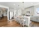 Bright kitchen with a white island, stainless appliances, and light grey cabinetry at 1601 Mariah Ln, Erie, CO 80516