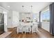 Bright kitchen with a large island, seating, stainless steel appliances, and mountain views at 1601 Mariah Ln, Erie, CO 80516