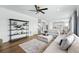 Open concept living room and kitchen with comfortable furniture at 1601 Mariah Ln, Erie, CO 80516