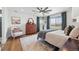 Serene main bedroom with a large window, dresser, and plush bedding, offering a relaxing retreat at 1601 Mariah Ln, Erie, CO 80516