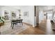 Bright office space with custom built-ins, wood floors, and a modern desk perfect for working from home at 1601 Mariah Ln, Erie, CO 80516