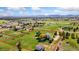 Aerial view of a large property with a home, outbuilding, and tree-lined perimeter at 15132 Pecos St, Broomfield, CO 80023