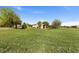 Huge backyard with lush green grass and mature trees at 15132 Pecos St, Broomfield, CO 80023