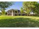 Expansive backyard with lush lawn and mature trees, perfect for outdoor living and entertaining at 15132 Pecos St, Broomfield, CO 80023