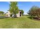 Well-maintained backyard with a patio, mature trees, and plenty of green grass at 15132 Pecos St, Broomfield, CO 80023