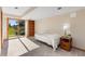 Bedroom featuring a sliding glass door to the backyard, a twin bed, and wood shelving at 15132 Pecos St, Broomfield, CO 80023