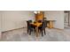 Dining room featuring a wooden table with black leather chairs and neutral carpeting at 15132 Pecos St, Broomfield, CO 80023